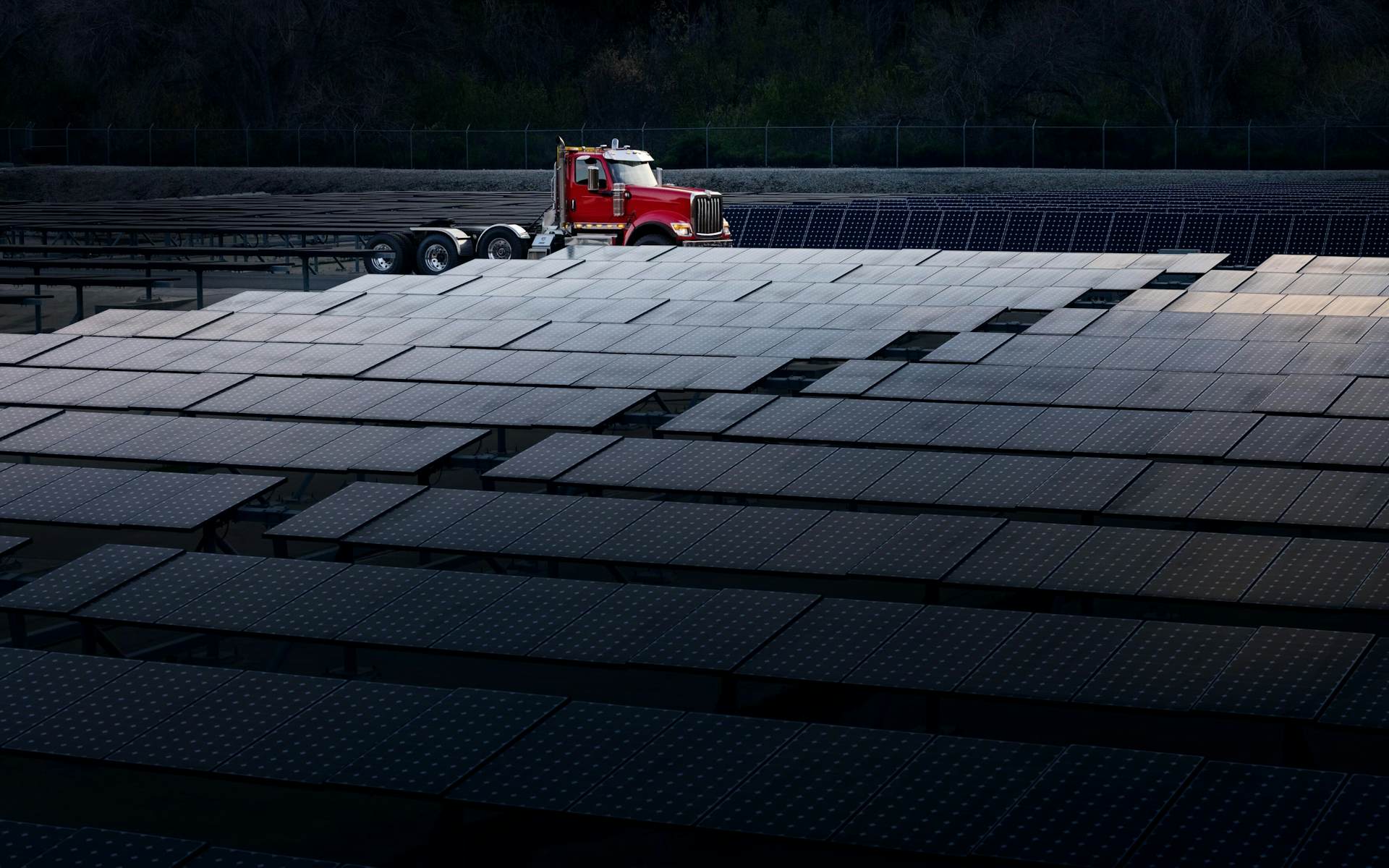 Red HX Series Day Cab Truck in background