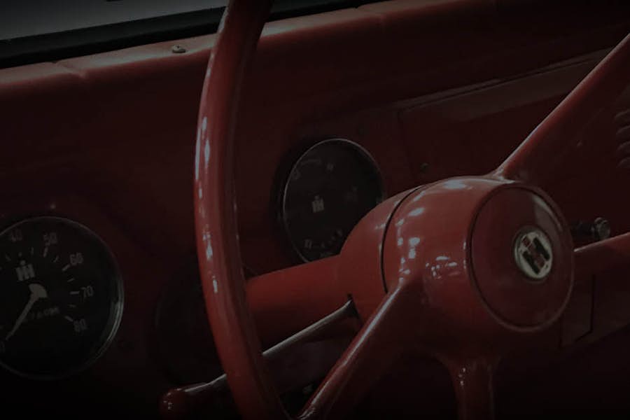 A steering wheel and gauges of a car