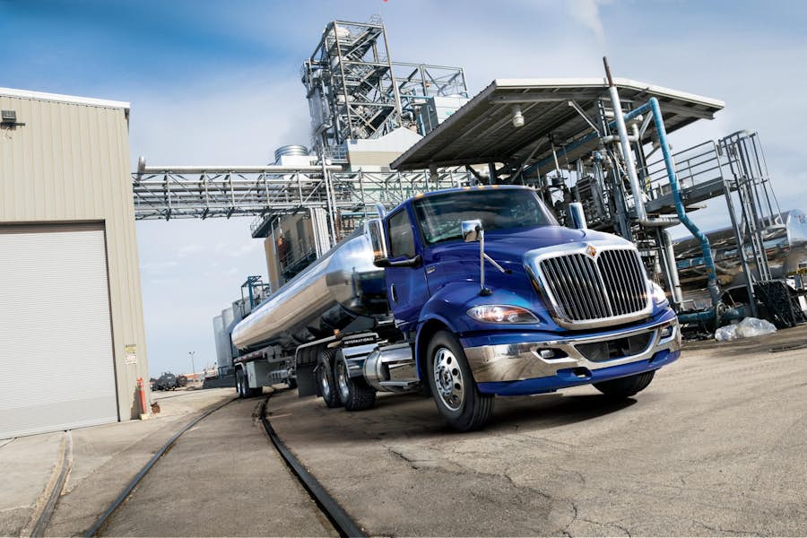 A blue truck with a tank on the side