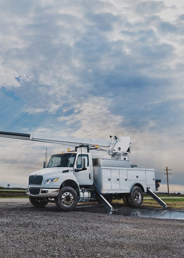 A truck with a crane on the side