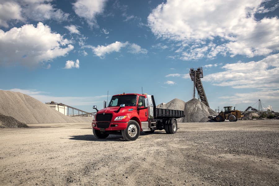 eMV stakebed dump front driver