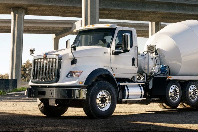 A white truck with a cement mixer