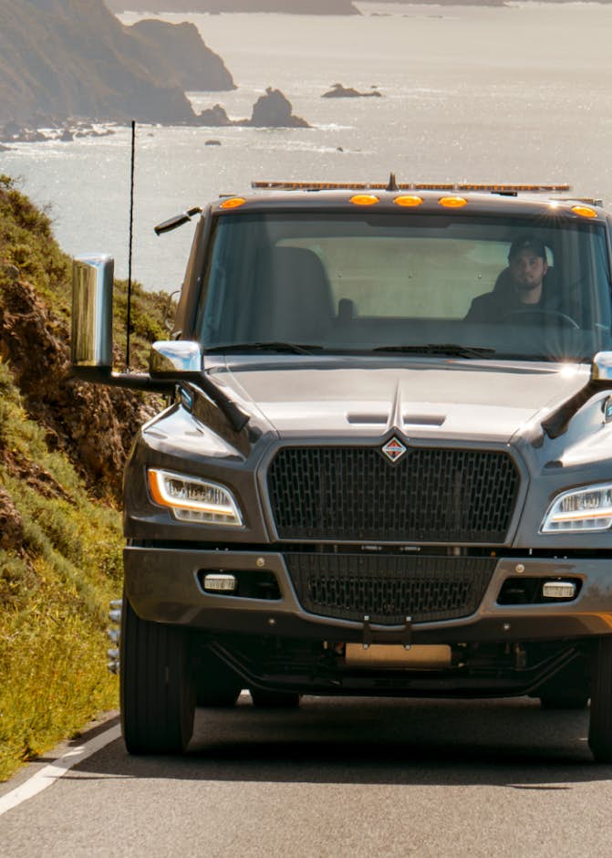 International truck driving on coastal highway