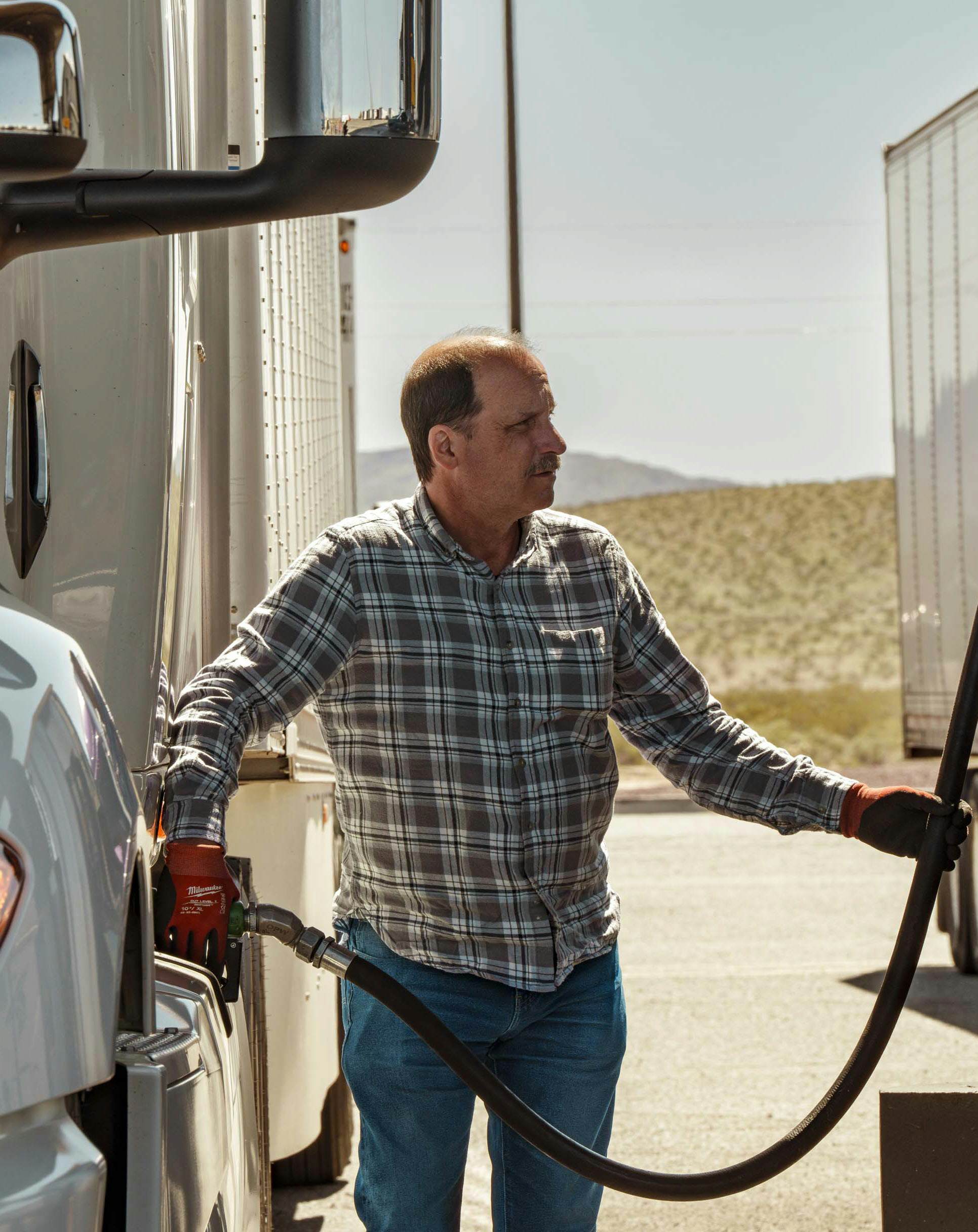 Driver refueling a truck