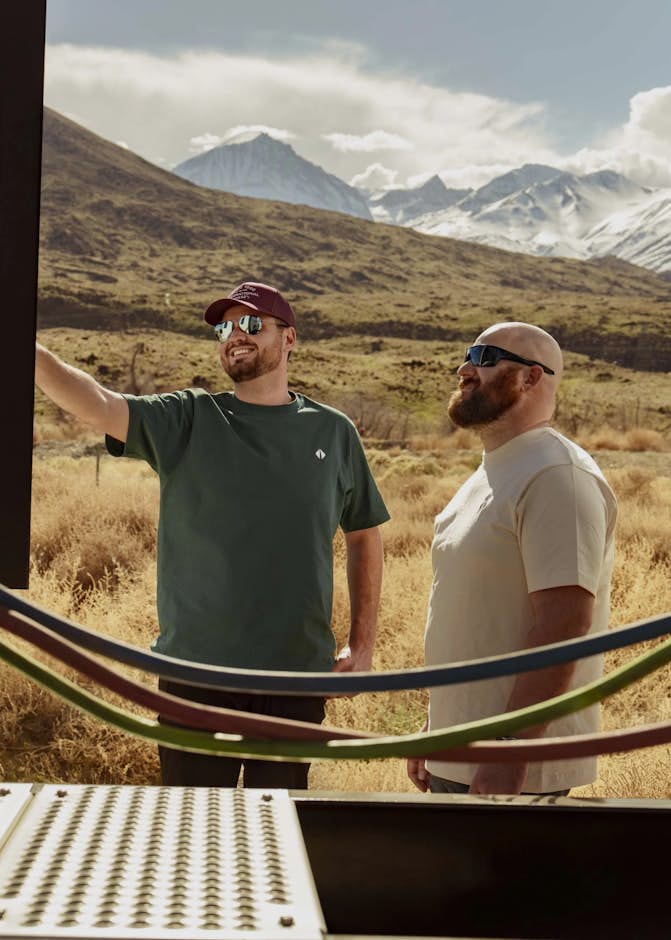 Two men standing in a field