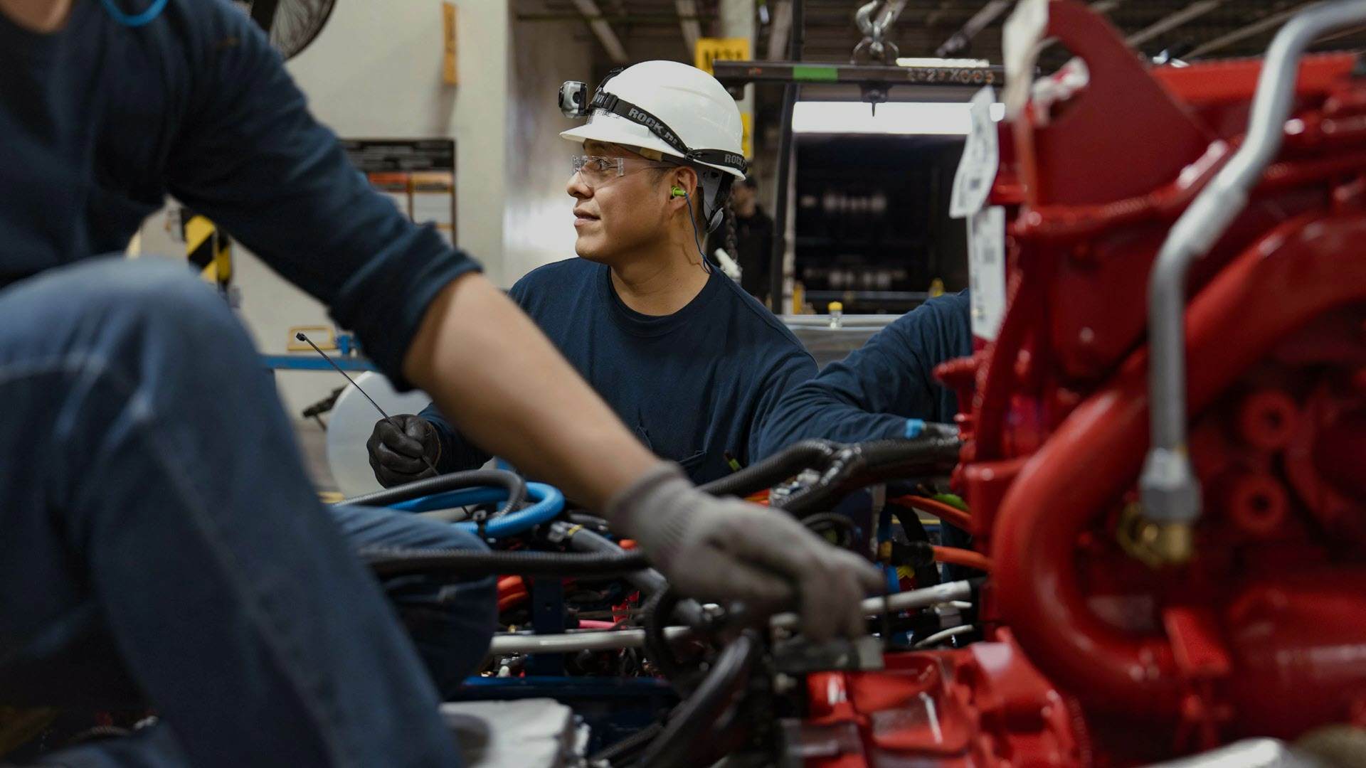 A group of men working on a machine