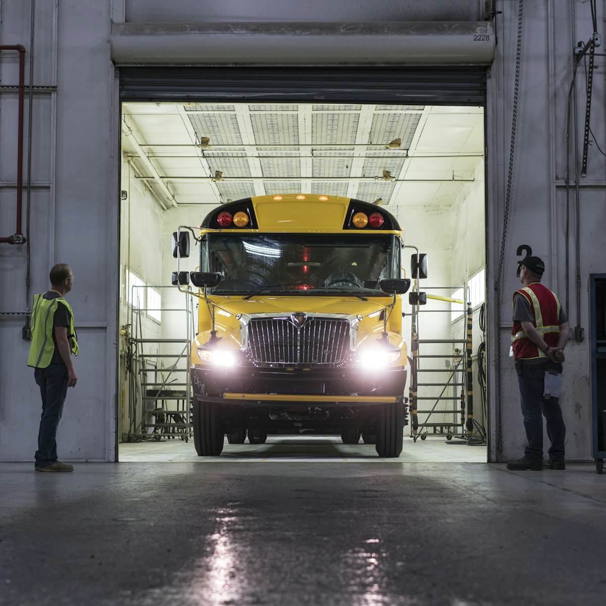 Employees surrounding a bus