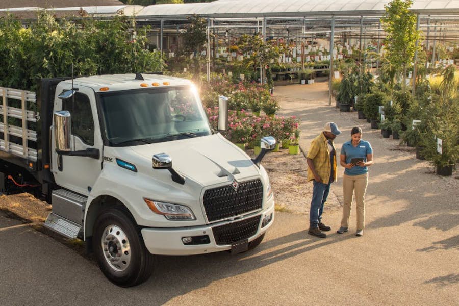 A truck with a white bed and a white metal frame