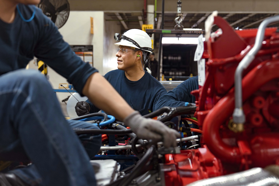 A group of men working on a machine